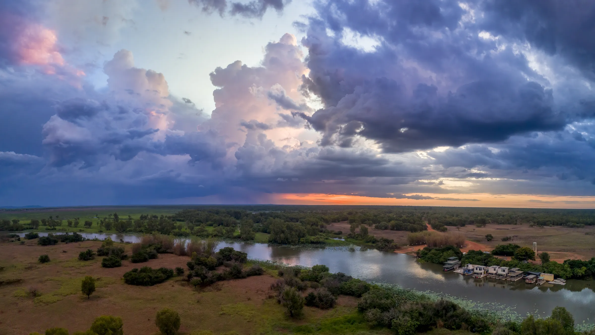 Storm clouds glowing over Corroboree Billabong and its floodplain